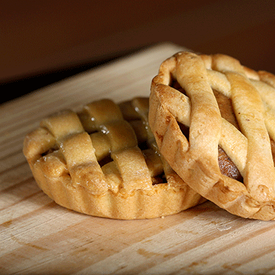 image of two small pies with lattice crust.